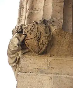 An angel carrying Jean sans Peur's coat of arms, in the large hall
