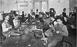 Crocker-Wheeler blind workers training to tape electric motor armature coils at the Double-Duty Finger Guild.