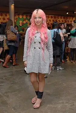 Image 92Brazilian girl wearing leg warmers, knitted sweater dress, and pastel hair, blending retro and alternative aesthetics into hipster style, 2011. (from 2010s in fashion)