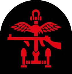 Insignia of Combined Operations units it is a combination of a red Thompson submachine gun, RAF wings and an anchor on a black backing