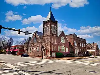 Large building complex with belltower and sanctuary.