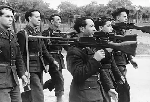 Members of the Milice with captured Bren guns.