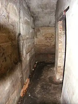 One of the barrack hallways with an entry point to the innermost chamber on the right hand side