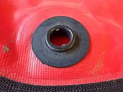 Buoyancy compensator internal fitting and gasket for filling hose or dump valve in place