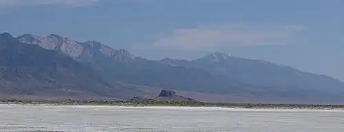 Flat expanse with a mountain range in the distance