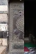 The doors of the mosque, made of wood overlaid with bronze fittings