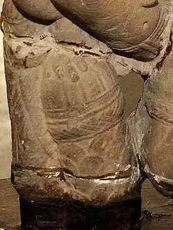 Vasudeva's ornate mace held by one of his supplementary hands