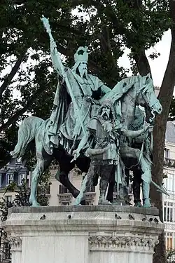 Charlemagne holding the scepter in the bronze group Charlemagne et ses Leudes by the Rochet brothers, Paris, 1878