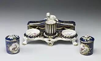 Porcelain inkstand set, 1759–1769. The style and the "mazarine blue" ground are borrowed from Sèvres. The Walters Art Museum.