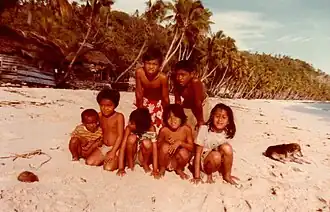 Children on the beach on Kiriwina, c. 1980