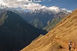 Steep trail to Choquequirao with snow-capped mountains in the background