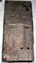 Tombstone of William Gatacre (1499-1577) and Eleanor Mytton, now mounted on wall of All Saints church.
