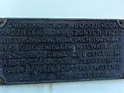 Plaque at the gate detailing those buried