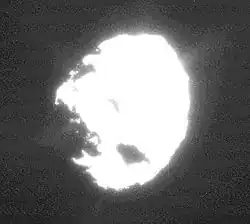An overexposed image of Wild 2 showing plumes of material coming from the surface
