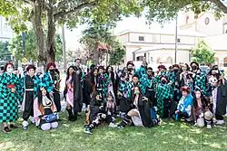 Popular Japanese media franchises such as Demon Slayer: Kimetsu no Yaiba, Chainsaw Man, Lycoris Recoil, Jujutsu Kaisen, Oshi no Ko, Frieren, Attack on Titan, Spy × Family, Dr. Stone, One Piece, Blue Lock, and Mashle reaching large international audiences and fans used for crossover works during the Reiwa era.