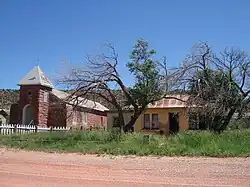 Cuervo's church with its deteriorated rectory