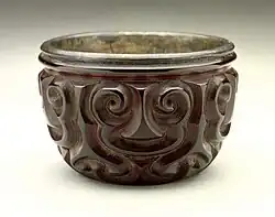 Bei (Cup) with guri Sword-Pommel Pattern, in tixi, with silver interior. Song or Yuan. Straight sides to grooves, and several thin layers of red.