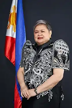 Lazaro in 2025, with silver hair, wearing a black Filipiniana