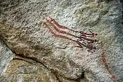 Rock painting of three figures with vapor trails near Bongani in southern Nsikazi