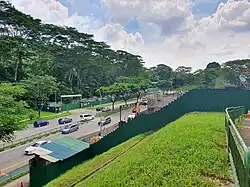 Construction site of a train station in 2023 taken from a hill, with machinery and scaffolding