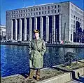 A US serviceman posing in front of the building in 1953