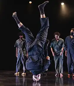 A dancer performing on his head