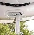 Early-style pull strap on a DeLorean gull wing door