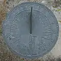 This sundial displays a likeness of Father Time. Its motto quotes Robert Browning: "Grow old along with me; the best is yet to be."