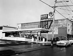 A black-and-white photograph of the Capitol Hill location of Dick's Drive-In, circa 1955.
