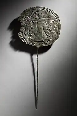 Animal-headed deity as master of animals, holding two panthers by their tails