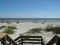 View of the beach from end of wooden boardwalk at Disney's Beach House