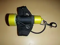 Small dive light on soft Goodman type handle, side view
