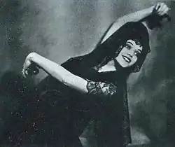 Doris Niles, smiling in a Spanish dance pose, from a 1922 issue of Broadway Brevities