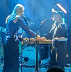 Duo Ruut (Katariina Kivi front left; Ann-Lisett Rebane front right) in 2023, performing at an Estonian traditional music festival