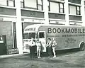 Library employees with bookmobile, outside of Parkway Towers