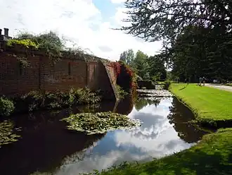 The moat on the west side of the hall.
