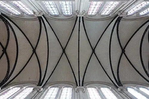 The exposed iron ribs of the vaults