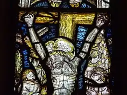 The crucifixion of Christ, stained glass window c. 1490, restored 1850.[7][10]