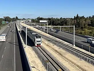 View from a bridge of the Ellenbrook line within the Tonkin Highway median strip