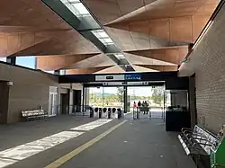 The entrance to the station viewed from the interior, with fare gates at the entrance