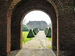 The hall viewed through the gatehouse arch