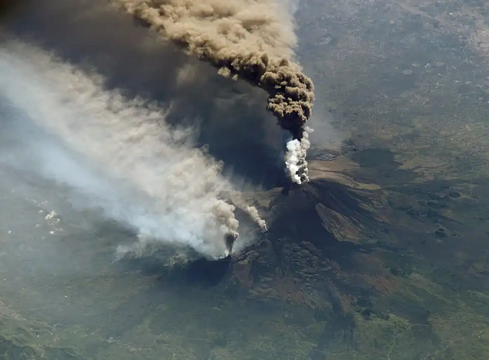 Image 58An October 2002 eruption of Mount Etna, a volcano on the Italian island of Sicily, as seen from the International Space Station. Etna is the largest of Italy's three active volcanoes and one of the most active in the whole entire world. This eruption, one of Etna's most vigorous in years, was triggered by a series of earthquakes. Ashfall was reported as far away as Libya, 600 km (373 mi) to the south. (Credit: Expedition 5 crew.) (from Portal:Earth sciences/Selected pictures)