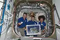 In honour of those affected by the 2011 Tōhoku earthquake and tsunami in Japan, Kondratyev (center), Nespoli & Coleman are pictured with origami cranes, which they folded to be placed in the HTV-2.