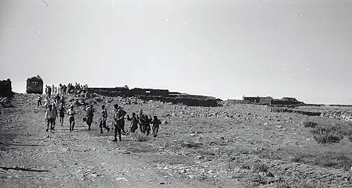 Forced transfer and displacement. Syrian civilians, hands raised, before Israeli soldiers, leave their homes in the Golan Heights