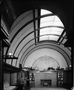 The interior of the playroom, which has a high barrel vaulted ceiling and a skylight