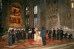 The apse, with a choir for scale. There is normally a rope at the top of the first steps.