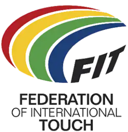 Logo showing a multicolored, stylized, oval-shaped, football. Four approximately concentric crescent shapes (red, yellow, green and blue on a white or light-colored background) are used to form the top and left parts of the ball. The three black capital letters F, I and T (all slightly curved and on the same white or light-colored background) are used for the bottom-right of the ball. The words "Federation of International Touch" (split over three lines of text) are positioned below the stylized ball.