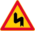 Dangerous curves, first bend to left (formerly used )