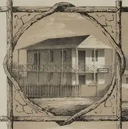19th-century house with "dentist" sign