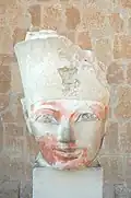 A stone head depicting Hatshepsut, wearing a crown